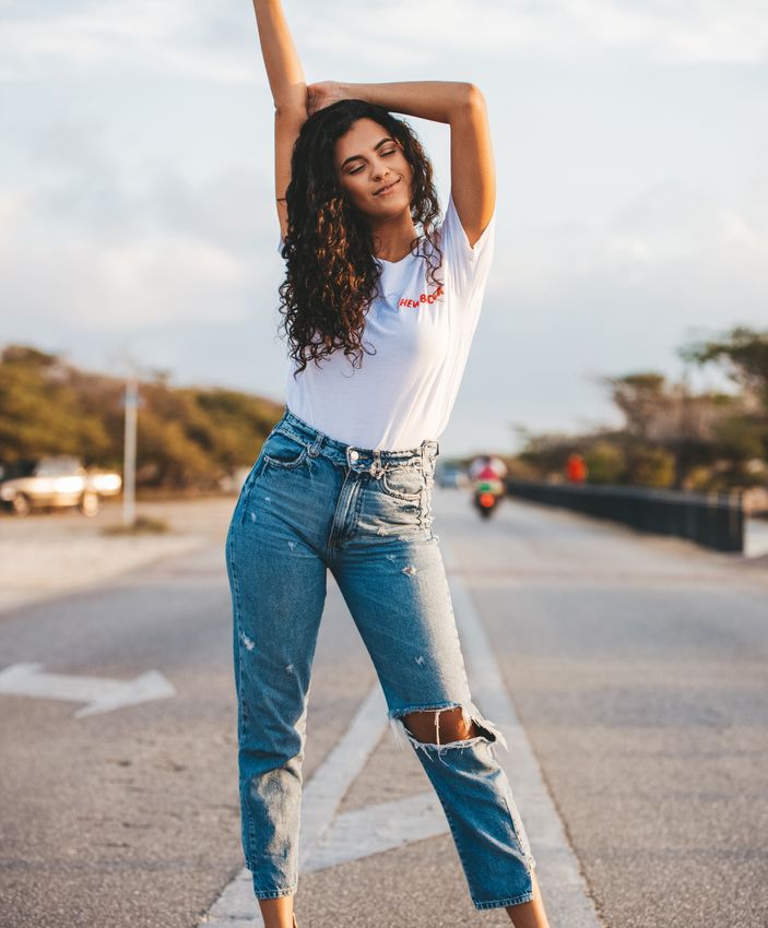 Palos Verdes Semaglutide model in jeans and a white t-shirt posing on the road