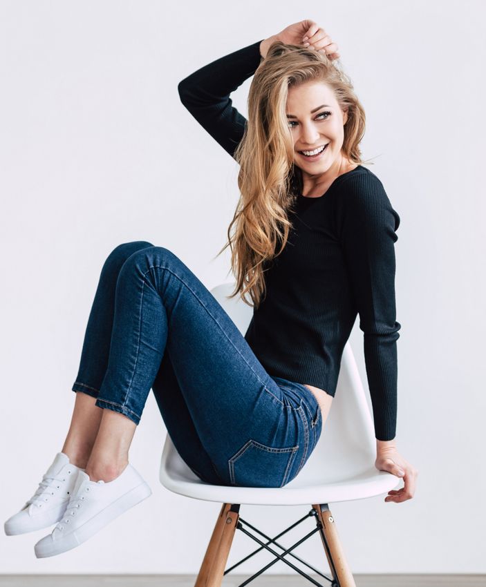 Palos Verdes Semaglutide model sitting on a chair smiling